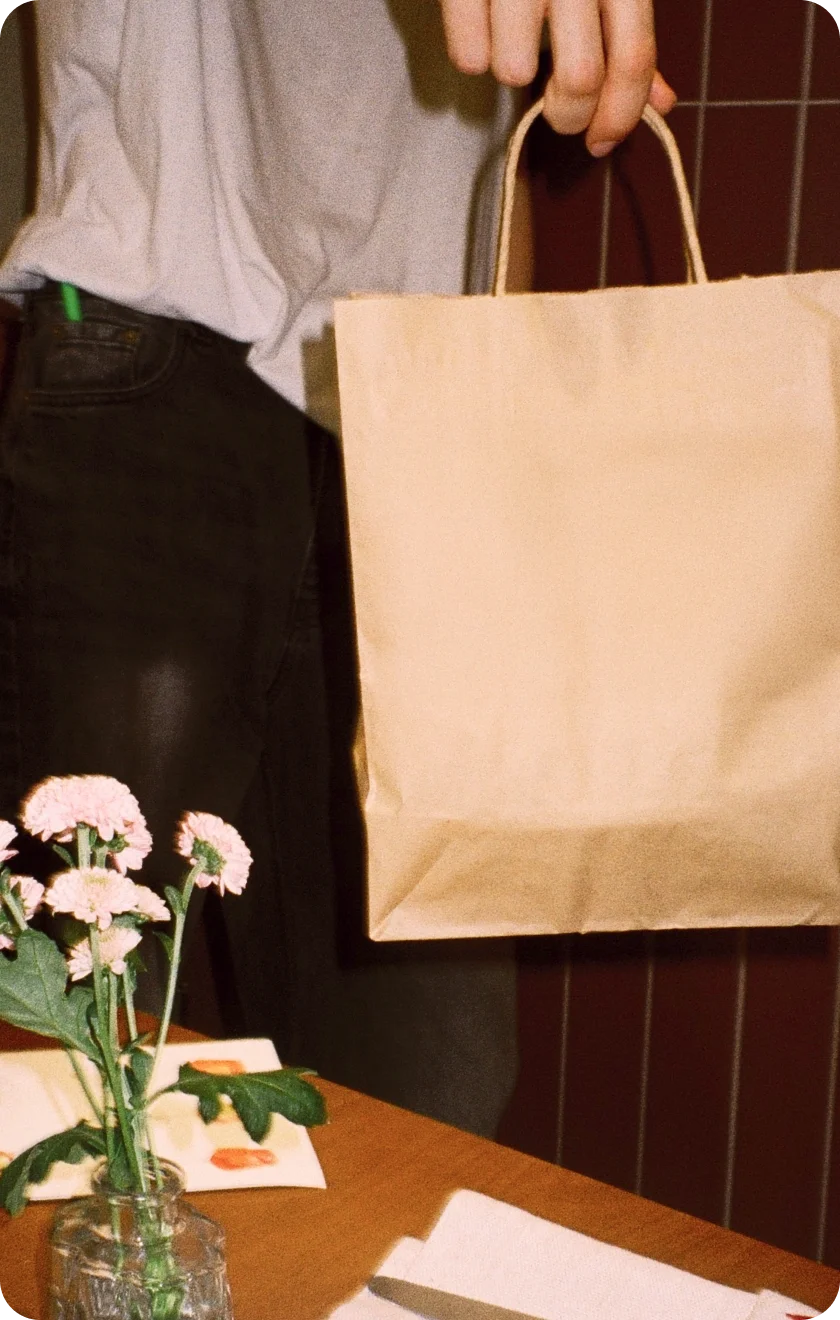a man with papper bag